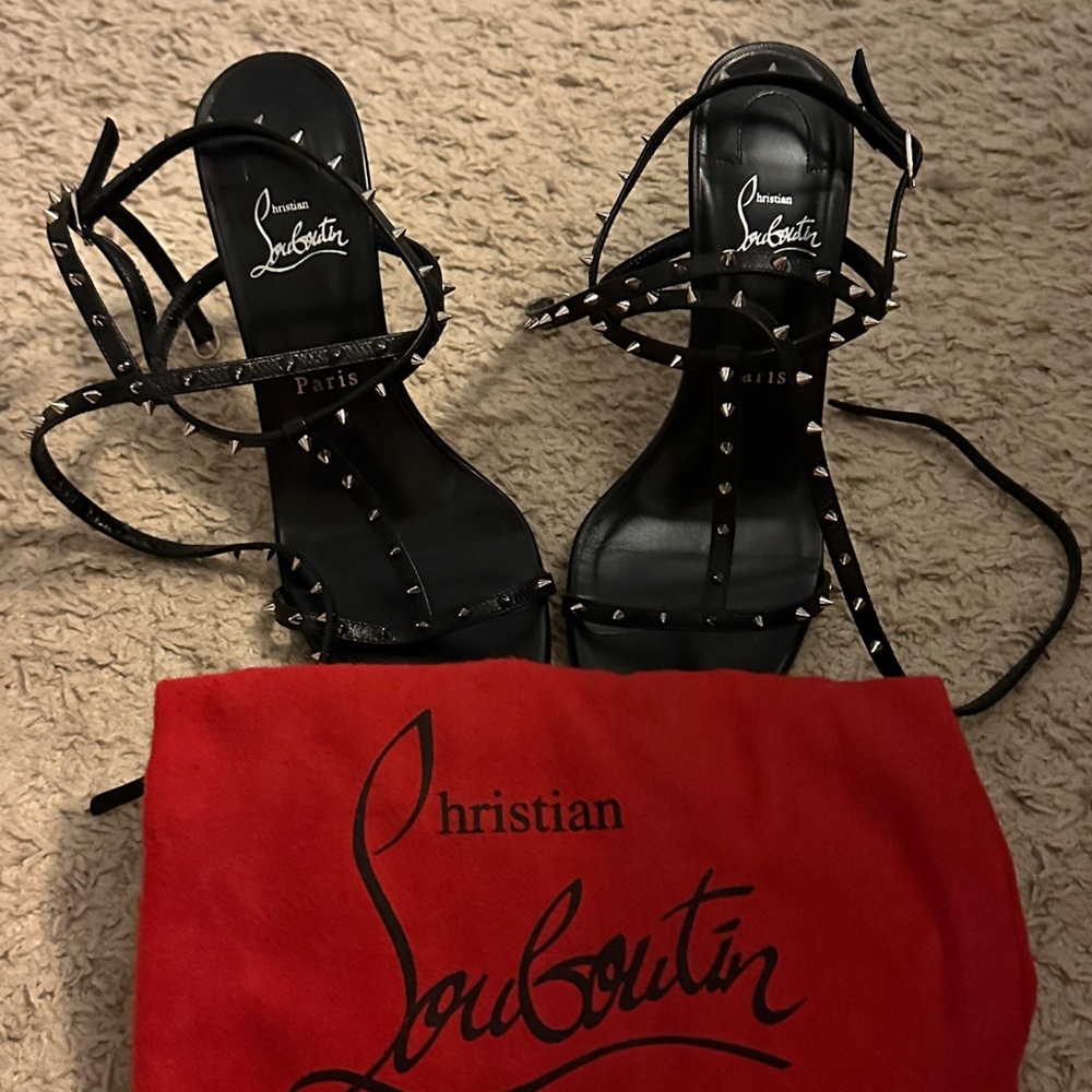 Christian Louboutin black, spiked heels.